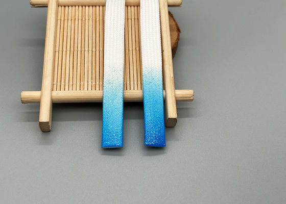 Poliestrowy sznurek ściągający o długości 30 cm z błyszczącymi silikonowymi kroplami na obu końcach